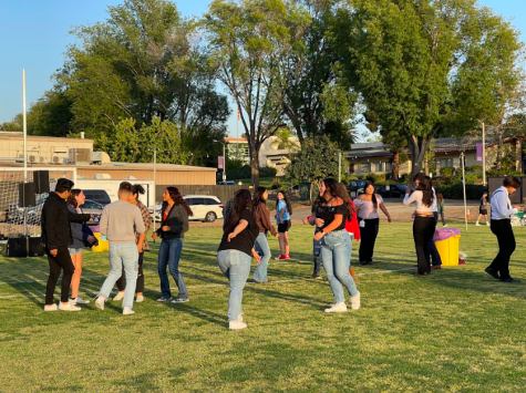 Students dancing to the live music provided at Caile to the Baile in Memorial Field. 
