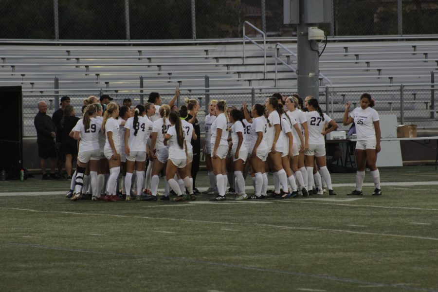 The Regals Soccer team celebrate together following their 1-0 at William Rolland Stadium.