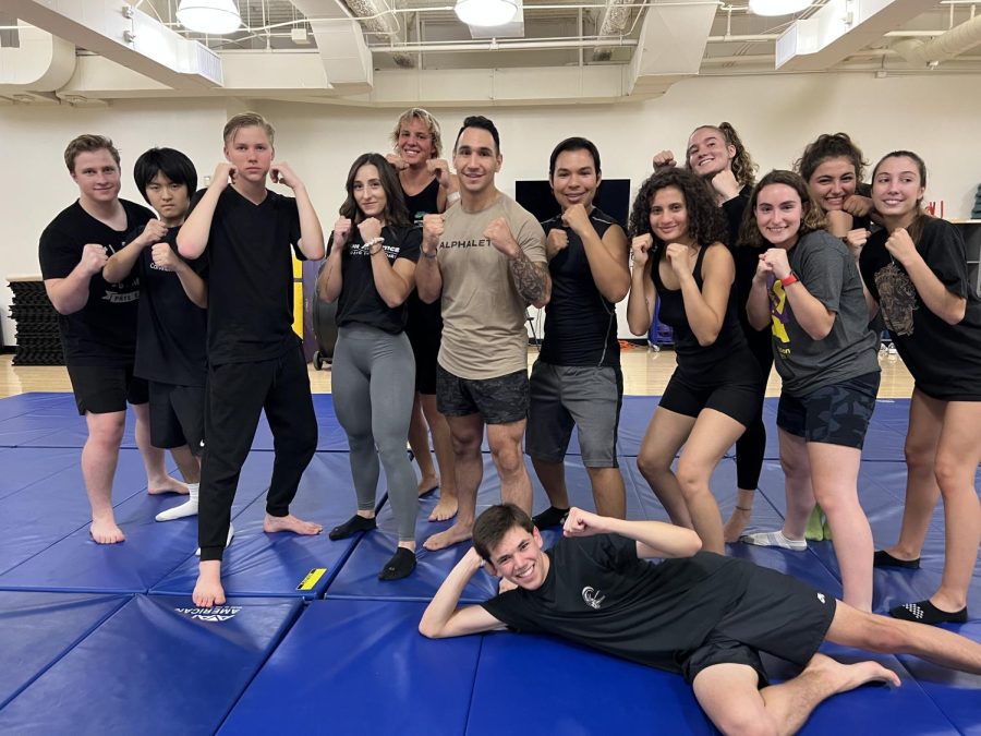 MMA+Club+members+pose+with+their+coach.