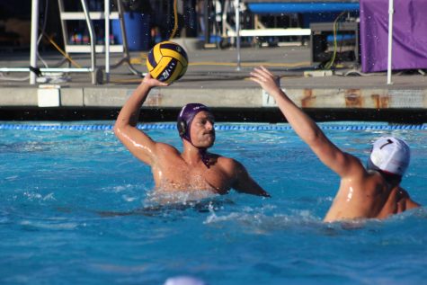 A member of Cal Lutherans Mens Water Polo team lines up a shot against Chapmans Panthers.