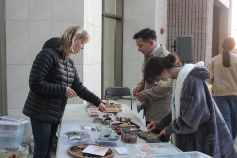 Artist and teacher Mona Lewis shows the crowd the works of art that are created from natural materials, such as rock and stone can be made into ochres, a natural clay Earth pigment used by Native American tribes. 