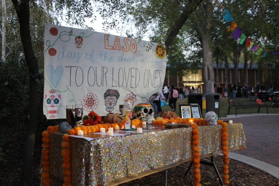 Participants+had+the+opportunity+to+bring+pictures+of+their+loved+ones+who%E2%80%99ve+passed+away+to+present+on+the+ofrenda.+This+tradition+of+creating+these+colorful+altars+is+believed+to+welcome+back+souls+of+deceased+loved+ones%2C+and+is+practiced+around+Latin+America.