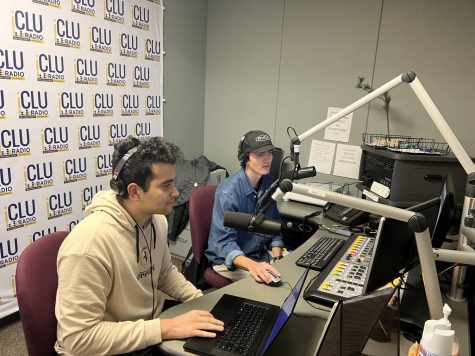 Harrison Dunkel, host of “The Backhouse Table” show on ICLU radio, is joined by his friend, Michael Effatian, who helping Dunkel prepare for his show.