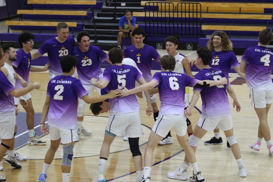 The Kingsmen volleyball team huddle before the game vs. Nazareth College.