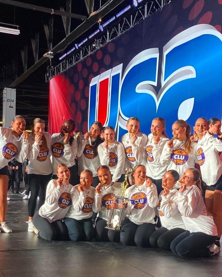 The+CLU+dance+team+poses+with+their+medals+and+trophy+after+the+USA+Collegiate+Championships.