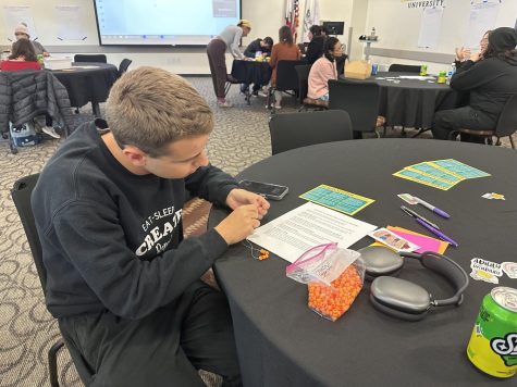 Sophomore Ethan Klein participates in bracelet-making at the Disability Awareness event hosted by Civic Engagement & Leadership and Disability Support Services. Each bead symbolized a different disability.