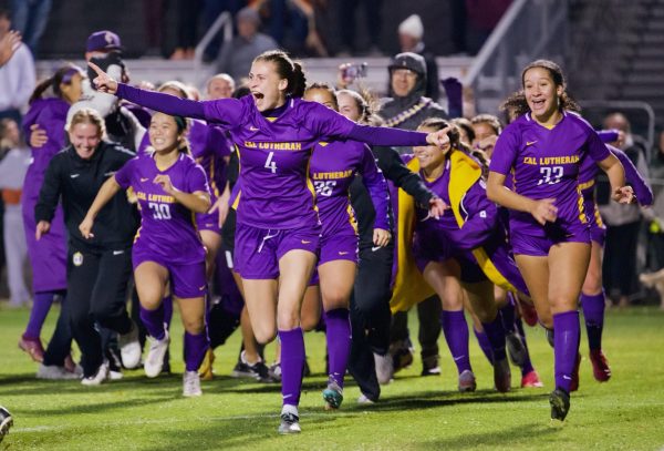 Regals soccer defender Avery West (pictured, center) celebrates the teams victory against Christopher Newmark University in the Elite Eight of the National Collegiate Athletic Association Division III Women’s Soccer National Championship in Virginia.