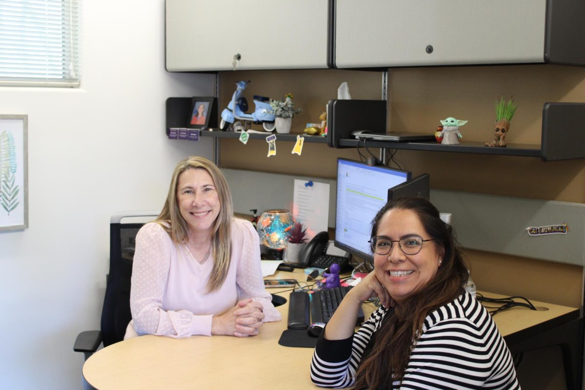 Student Success Counselor Beth Walker and Assistant Registrar for Academic Scheduling and Planning, Emily Yamamoto, smile for a photo.