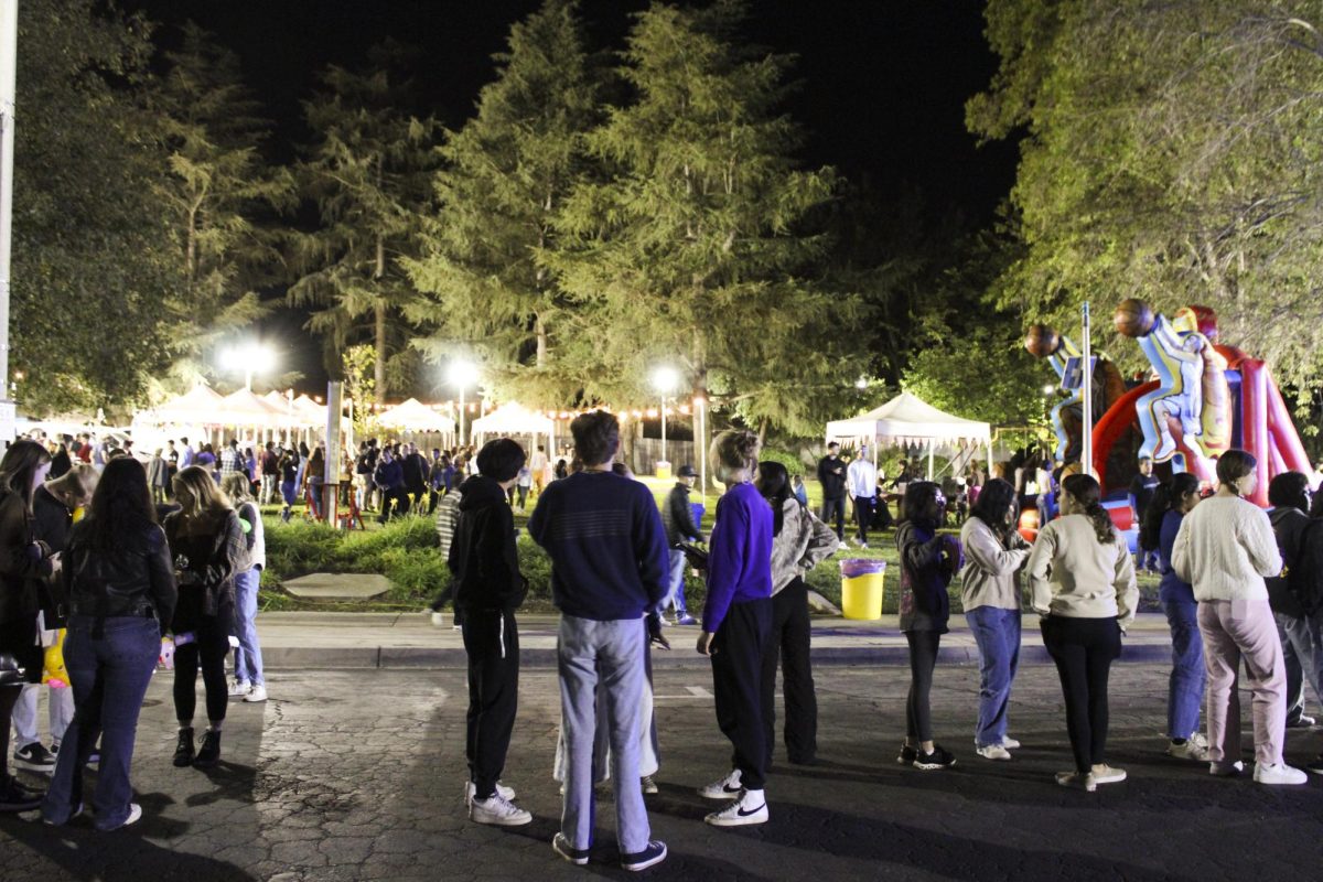 Guests wait in line for the Ferris wheel at the Fall Carnival, organized by Associated Students of California Lutheran University Government.