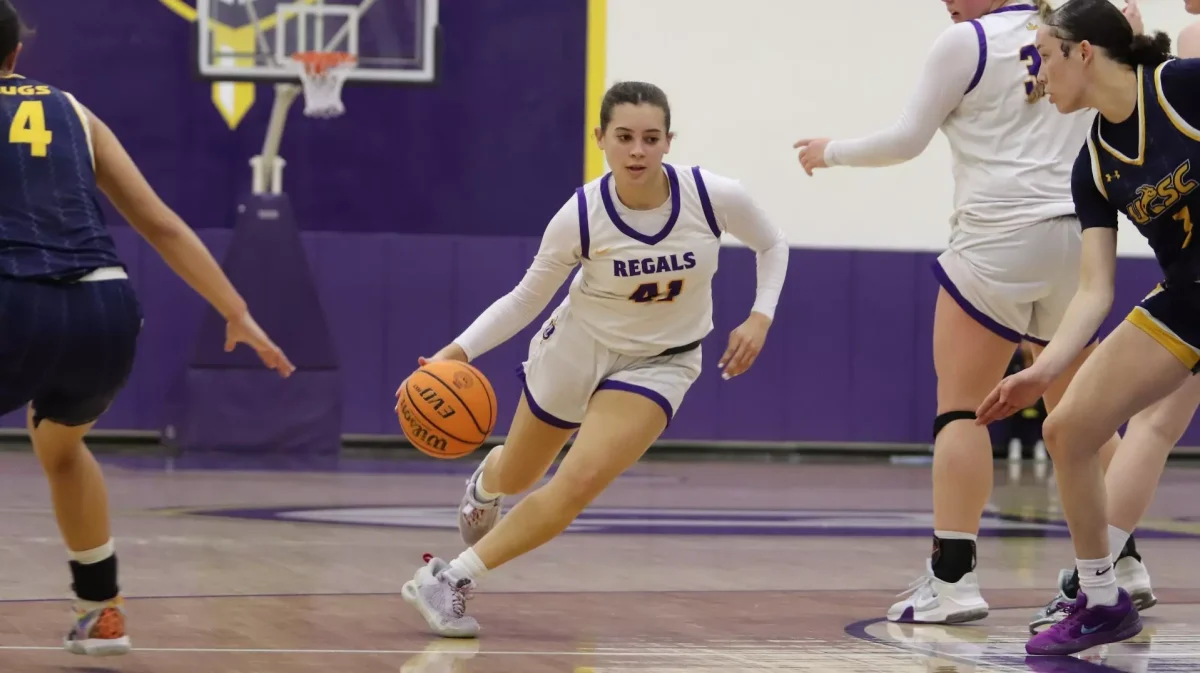 Sophomore guard Kaiya Mack dribbling the ball.