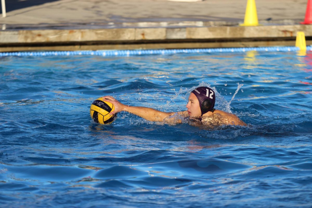 Tommy Riffle in the water with the ball. 