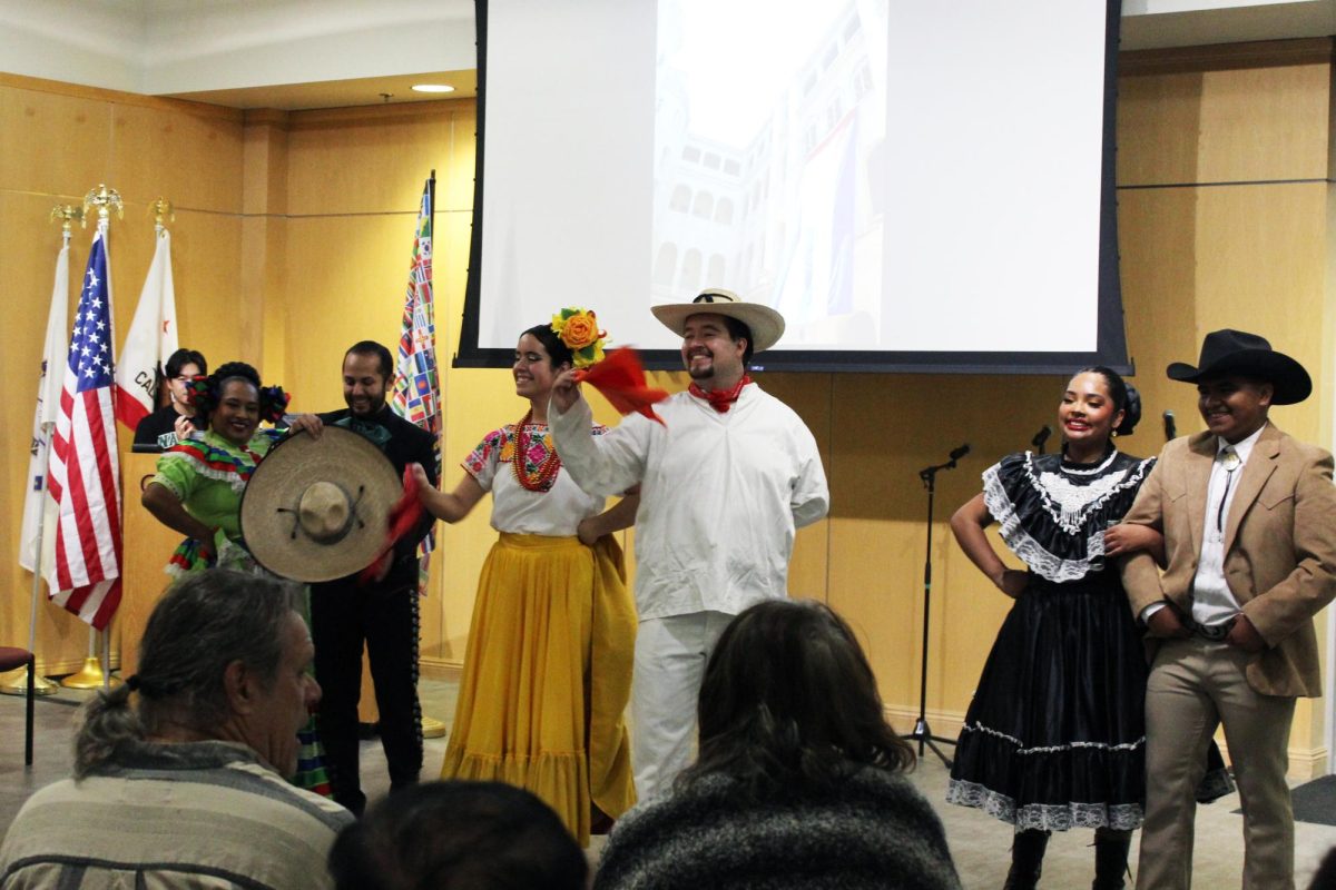 Performers at the World Fair dance to traditional Mexican ballads.