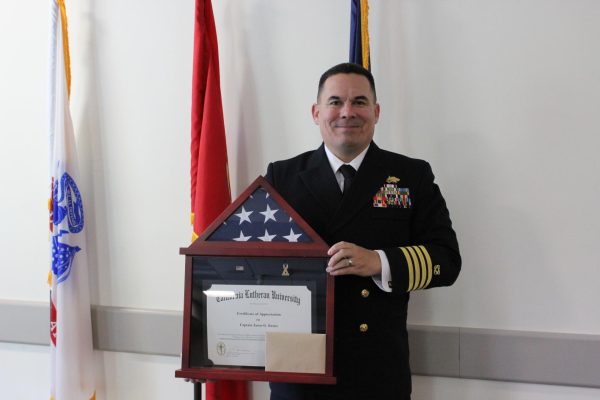 Captain Kranz with the gift Cal Lutheran's Ahmanson Veterans Resource presented to him.