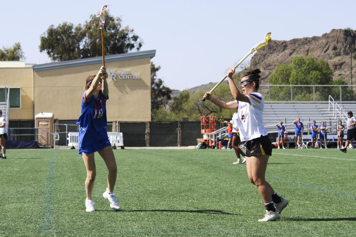 Sydney Shin prepares to pass the ball to her teammate.