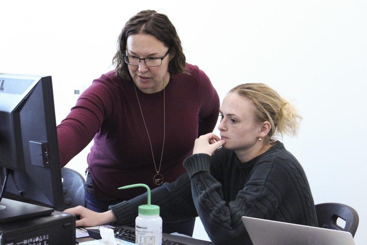 John Stauffer Professor of Analytical Chemistry Katherine Hoffmann instructs sophomore Tessa French during a chemical instrumentation lab class.