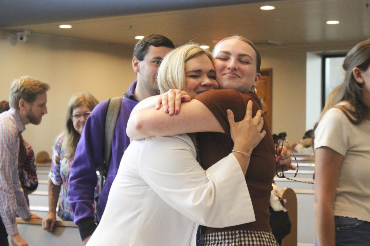Pastor Beth and Bre Freiberg embrace each other after Thursday's installation.