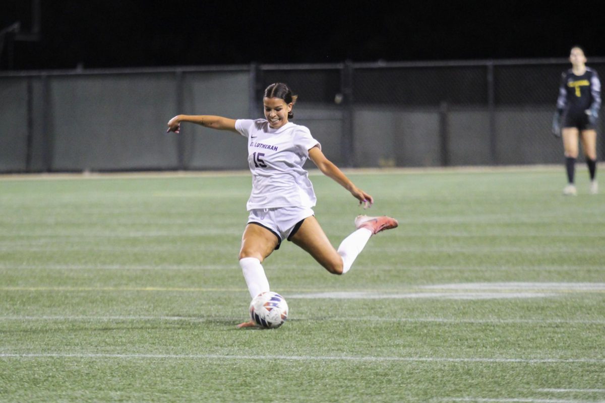 Junior defender Hannah Gamez fires a pass downfield.