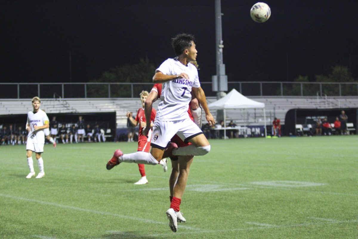 Senior midfielder Tika Kakimoto rises up to head the ball.