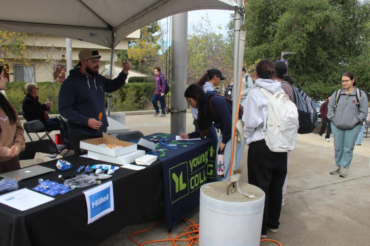 Attendees can visit a variety of booths offering candy, necklaces, and other treats. 