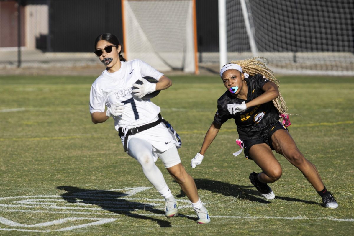 Junior rusher Julia “Juju” Sayyid rushed to steal the flag of her opponent.